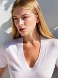 Top Portofino 100% Capri pink and white linen top worn by model