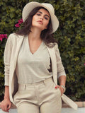 Top V for woman 100% Capri natural color and linen top worn by a model Top V for woman 100% Capri natural color and linen top worn by a model