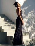 Model wearing Firenze blu linen maxi dress with open back – 100% Capri