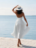 Model wearing Marilyn white linen dress, back view – 100% Capri