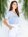 polo miami 100% Capri jeans and white linen polo worn by model